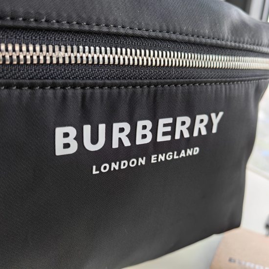 2024.03.09p650 Burberry Backpack, featuring a brand new ECONYL material decorated with a logo. Paired with smooth leather trim, the shoulder straps are embellished with a Burberry lettering logo embroidered with jacquard. ECONYL is a sustainable nylon fab