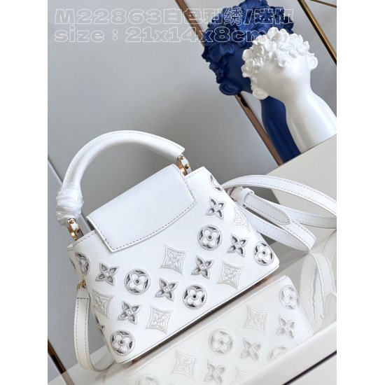 20231125 P1520 [Exclusive real shot M22863 white embroidery/mini] This Capucines mini handbag was created by Nicolas Ghesquire, highlighting the LV Broderie Anglaise theme of the brand's early autumn 2022 collection. The cow leather bag is embellished wit