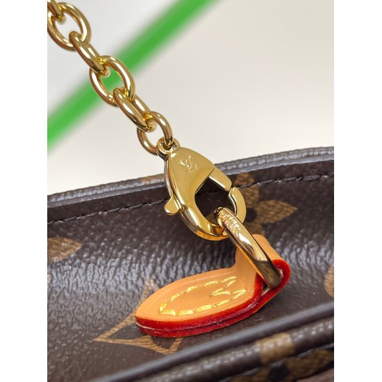 20231125 p450, M82509 Old Flower Lily wallet on chain is made from Monogram canvas wallet, combining a fashionable rectangular shape with a subtle retro appearance. Its flip cover is adorned with golden decorative panels, rivets, and engraved with the Lou