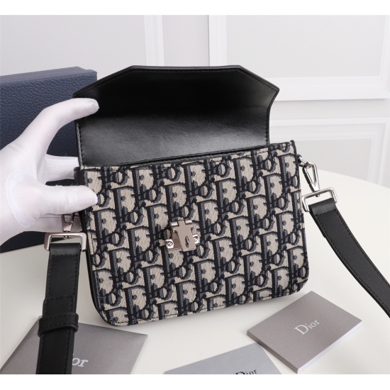 20231126 610 This messenger bag is classic and elegant, showcasing personal charm. Crafted with beige and black Oblique printed fabric. The design is tough and adorned with a black smooth cowhide flip, paired with a metal clad brass buckle closure. The in