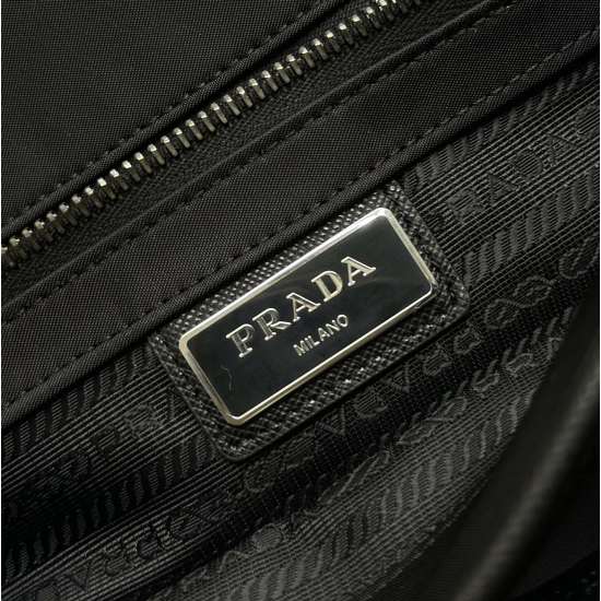 2024.03.12 P710 New Men's Crossbody Bag, Large Postman Bag, Comes with Small Bag 2VD768. This nylon flap handbag is adorned with classic Saffiano leather trim, equipped with two side buckles and the iconic triangular metal logo, showcasing a fashionable d