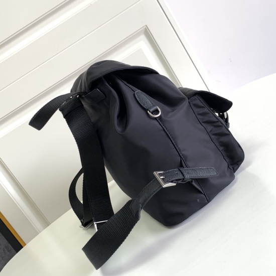 2024.03.12 P630 New Backpack 1BZ811 This nylon backpack features exquisite Saffiano leather trim, blending multiple materials, and adorned with a triangular logo, showcasing fashionable and elegant charm. Also equipped with a detachable small handbag, it 