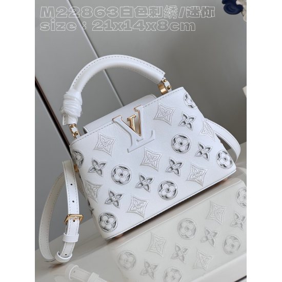 20231125 P1520 [Exclusive real shot M22863 white embroidery/mini] This Capucines mini handbag was created by Nicolas Ghesquire, highlighting the LV Broderie Anglaise theme of the brand's early autumn 2022 collection. The cow leather bag is embellished wit